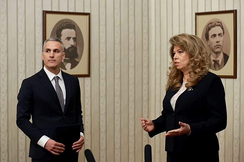 Incumbent Bulgarian President Iliana Yotova (right) appointing current presidential candidate Andrey Gyurov (left) as caretaker Prime Minister on 12 February 2026.