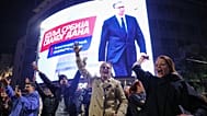 Youngsters cheer after polls closed in the parliamentary election in Belgrade, Serbia, Sunday, 25 October, 2026.