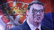 A defaced poster of Aleksandar Vučić lies on the pavement outside the National Assembly in Belgrade, Serbia, 25 October, 2026. 