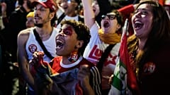 Supporters of President Luiz Inacio Lula da Silva, who is seeking reelection, cheer as presidential runoff results are announced in Sao Paulo.
