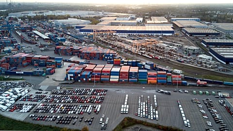 FILE. The sun sets behind the Duisport Logport logistics centre on the Rhine River in Duisburg, Germany, 28 October 2022