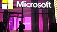  People walk past a Microsoft office in New York, Nov. 10, 2016.