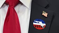 Trump wears an "I voted" badge