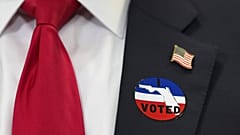 Trump wears an "I voted" badge