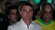 المرشح الرئاسي فلافيو بولسونارو لدى وصوله إلى مقر تجمع انتخابي في برازيليا، 25 أكتوبر 2026.