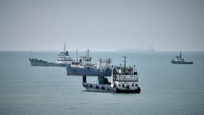 Commercial vessels lie anchored in the Strait of Hormuz off Bandar Abbas, Iran, Friday, Sept. 4, 2026. (AP Photo/Vahid Salemi)