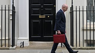 Britain's Chancellor of the Exchequer John Healey leaves 11 Downing Street with the ministerial red box heading to the House of Commons to deliver the budget statement.