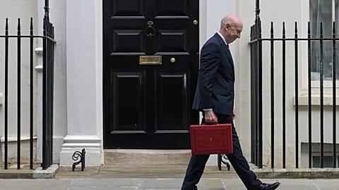 Britain's Chancellor of the Exchequer John Healey leaves 11 Downing Street with the ministerial red box heading to the House of Commons to deliver the budget statement.