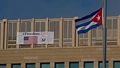 A sign reading "Freedom 250," marking the 250th anniversary of US independence, hangs alongside a Cuban flag in Havana. 28 October 2026.
