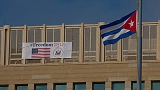 A sign reading "Freedom 250," marking the 250th anniversary of US independence, hangs alongside a Cuban flag in Havana. 28 October 2026.