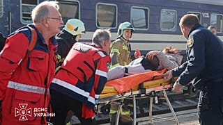 Rescuers evacuate a wounded civilian after a Russian drone attack on a railway platform in Dnipro, Ukraine, Thursday, 29 October, 2026.