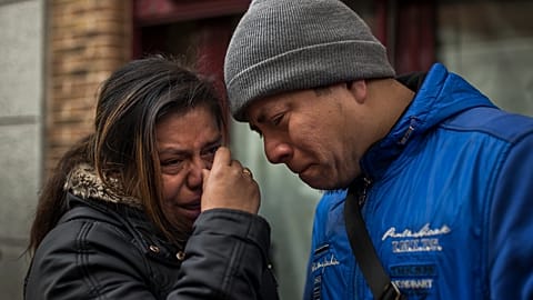 Jessica Bernice Michelena and her husband Eduardo Lucas Zambrano cry after being evicted from their home in Madrid, Spain, Tuesday, Feb. 3, 2015.