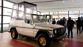 A popemobile used by successive popes is displayed at "A Century of the Popemobile," an exhibition tracing 100 years of papal transportation.