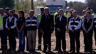 People observing minute of silence at site of train crash