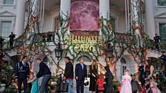 President Donald Trump and first lady Melania Trump attend a Halloween event on the South Lawn of the White House.