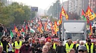Workers, students and activists demonstrate during a nationwide general strike called by grassroots unions to protest rising living costs, low wages and military spending.