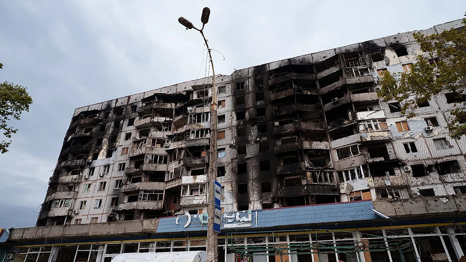 Building damaged from Russian attacks is seen during a local ceasefire related to a humanitarian aid mission in Oleshky, in Kherson, Ukraine, Thursday, Oct. 29, 2026.
