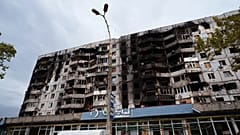 Building damaged from Russian attacks is seen during a local ceasefire related to a humanitarian aid mission in Oleshky, in Kherson, Ukraine, Thursday, Oct. 29, 2026.